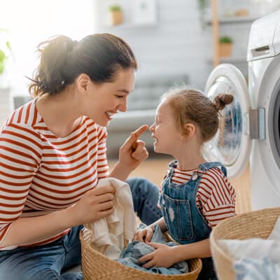 mom-doing-laundry-with-daughter-sq.jpg - River City Wellness