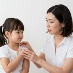 Signs your child needs to see a chiropractor - Austin mother comforting uncomfortable daughter with health concerns