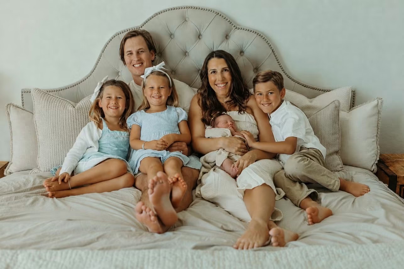 A Dad's Guide to Birth and Beyond 2 Parents with their four children, including a newborn, together at home
